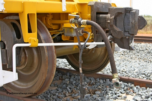 BH 11 081225 0568
Barker Siding, one of FMG's thirty five ballast waggons, BH 11, view of F type coupler and air and electric connections, 100 tonne capacity, built in China by CSR at the Yangtze Rolling Stock Company in 2008. December 25, 2008.
Keywords: BH11;CSR-Yangtze-Rolling-Stock-Co-China;FMG-ballast-waggon;