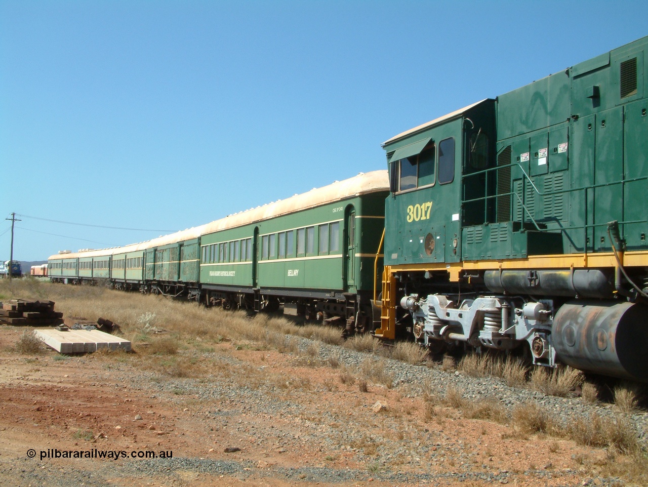 041014 142329
Pilbara Railways Historical Society, view along the passenger carriages behind rebuilt ALCo C636R locomotive 3017 with the first passenger carriage 'Bellary' was originally built by Clyde Engineering at Granville NSW in 1936 for the NSWGR as a second class railway carriage FS type FS 2143. In 1987 it was purchased by the Society and is named after a local river. The next carriage is van 'Portland' and originally an NSWGR MHO type guards van MHO 2321, then recoded to KB type mail van, then to KBY 2513 guards van. 14th October 2004.
Keywords: 3017;Comeng-WA;ALCo;C636R;WA-135-C-6043-04;rebuild;