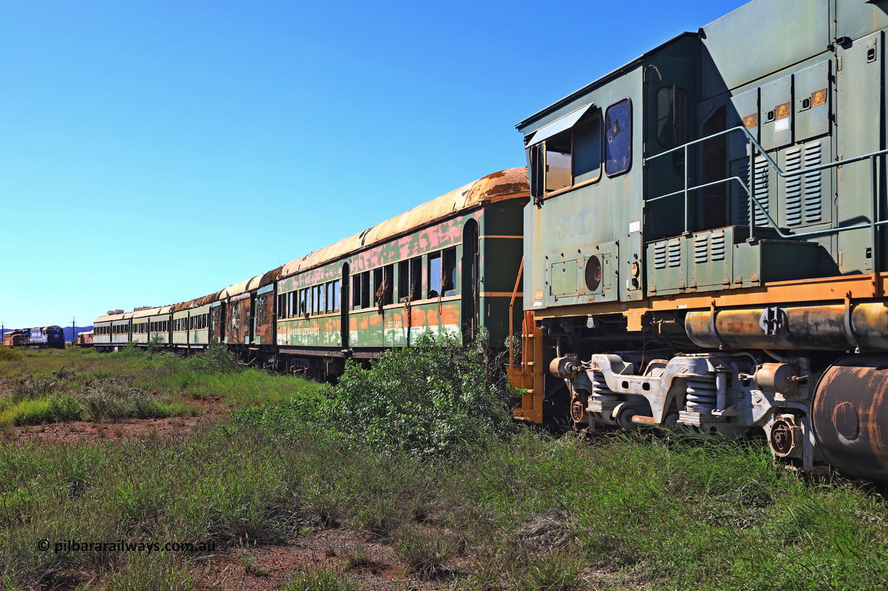 240701 2740
Pilbara Railways Historical Society, view along the passenger carriages behind rebuilt ALCo C636R locomotive 3017 with the first passenger carriage 'Bellary' was originally built by Clyde Engineering at Granville NSW in 1936 for the NSWGR as a second class railway carriage FS type FS 2143. In 1987 it was purchased by the Society and is named after a local river. The next carriage is van 'Portland' and originally an NSWGR MHO type guards van MHO 2321, then recoded to KB type mail van, then to KBY 2513 guards van. For a view 20 years ago, [url=https://pilbararailways.com.au/gallery/displayimage.php?pid=15299]click here[/url]. July 1, 2024.
