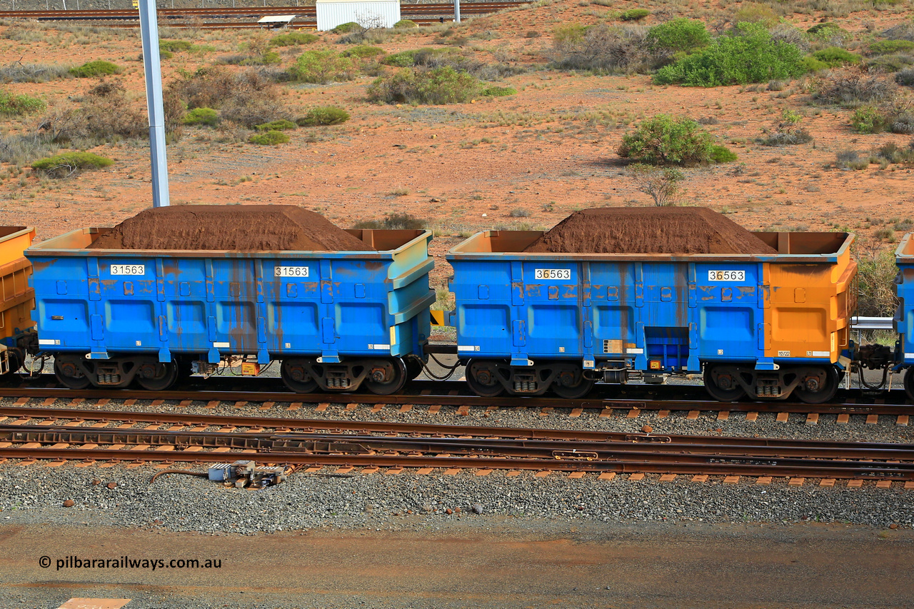240619 0371
Cape Lambert yard, one of Rio Tinto's blue rakes with spring park brake and only electronic controlled pneumatic [ECP] braking, waggon pair 31563 is a master and is bar coupled to slave waggon 36563 built by China Northen as a Q type in 12/2022. Captured on June 19, 2024.
Keywords: 31563;36563;Q-type;China-Northern;Rio-ore-waggon;