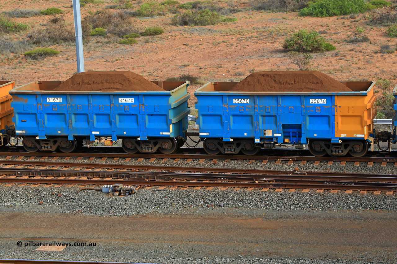 240619 0396
Cape Lambert yard, one of Rio Tinto's blue rakes with spring park brake and only electronic controlled pneumatic [ECP] braking, waggon pair 31670 is a master and is bar coupled to slave waggon 35670 built by China Northen as a Q type in 11/2022. Captured on June 19, 2024.
Keywords: 31670;35670;Q-type;China-Northern;Rio-ore-waggon;