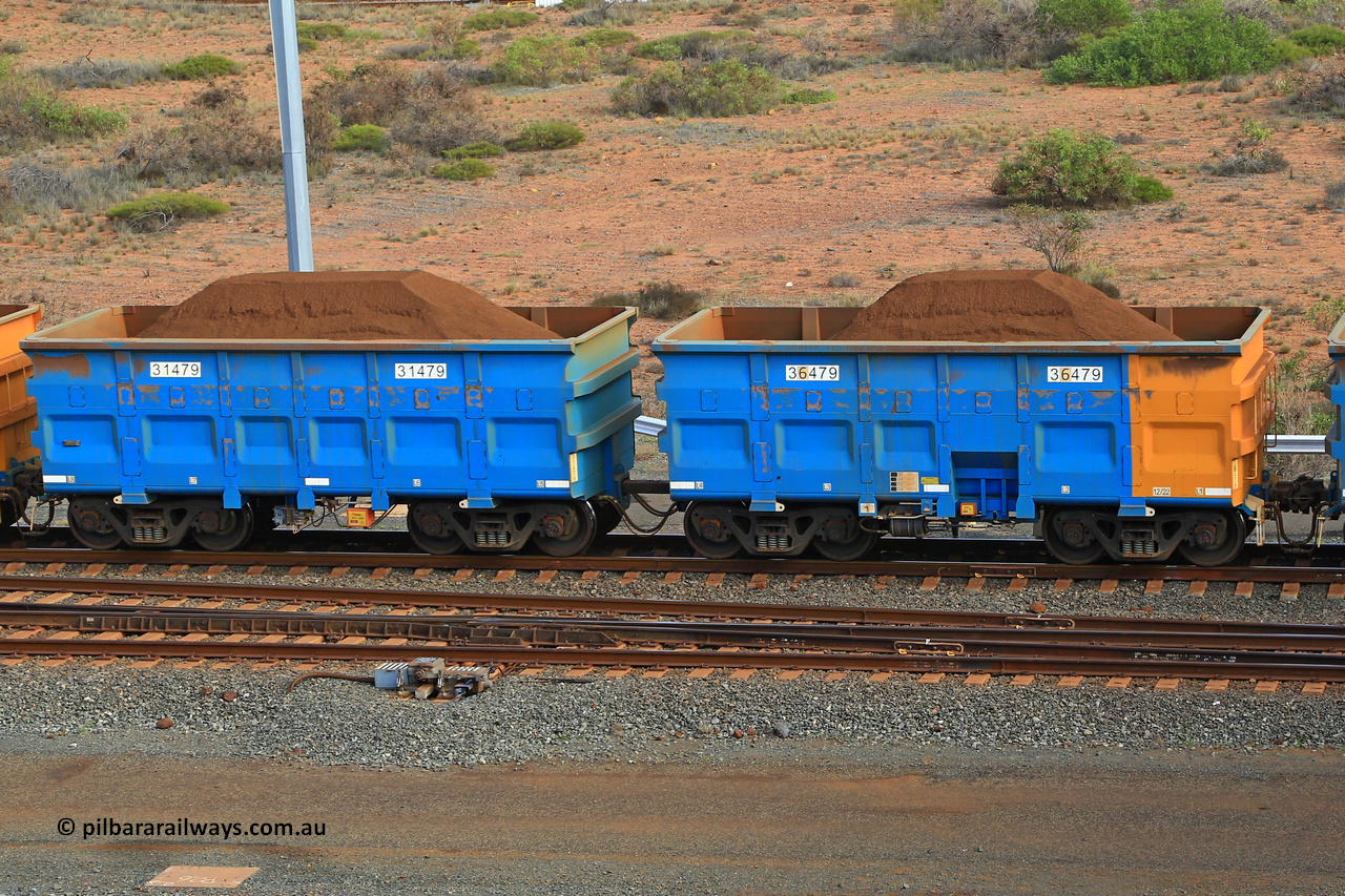 240619 0397
Cape Lambert yard, one of Rio Tinto's blue rakes with spring park brake and only electronic controlled pneumatic [ECP] braking, waggon pair 31479 is a master and is bar coupled to slave waggon 36479 built by China Northen as a Q type in 12/2022. Captured on June 19, 2024.
Keywords: 31479;36479;Q-type;China-Northern;Rio-ore-waggon;