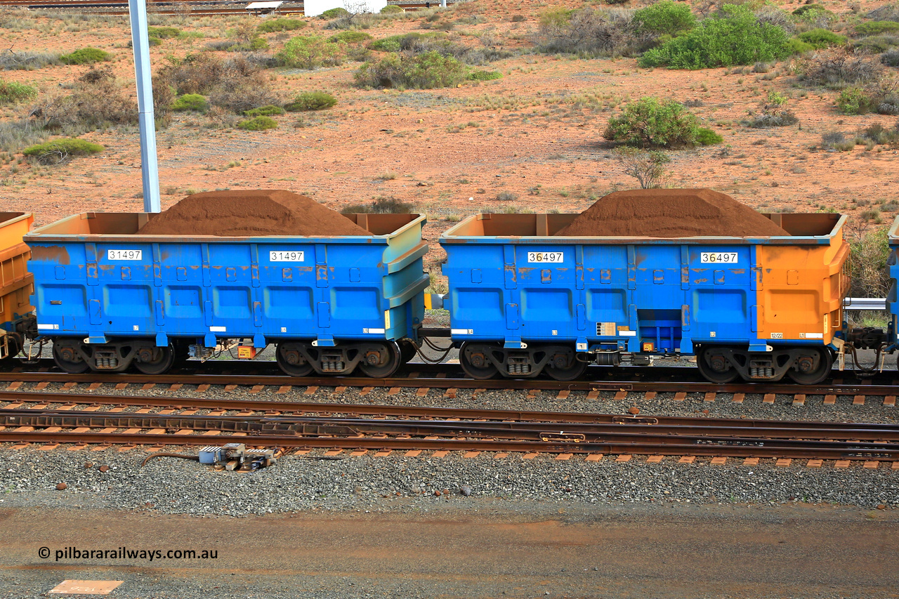 240619 0398
Cape Lambert yard, one of Rio Tinto's blue rakes with spring park brake and only electronic controlled pneumatic [ECP] braking, waggon pair 31497 is a master and is bar coupled to slave waggon 36497 built by China Northen as a Q type in 12/2022. Captured on June 19, 2024.
Keywords: 31497;36497;Q-type;China-Northern;Rio-ore-waggon;