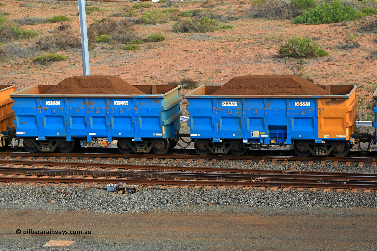 240619 0399
Cape Lambert yard, one of Rio Tinto's blue rakes with spring park brake and only electronic controlled pneumatic [ECP] braking, waggon pair 31559 is a master and is bar coupled to slave waggon 36559 built by China Northen as a Q type in 12/2022. Captured on June 19, 2024.
Keywords: 31559;36559;Q-type;China-Northern;Rio-ore-waggon;