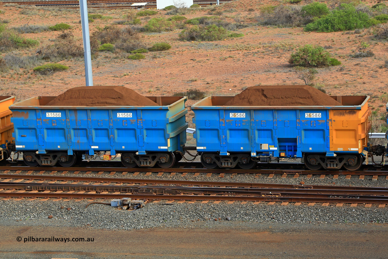 240619 0400
Cape Lambert yard, one of Rio Tinto's blue rakes with spring park brake and only electronic controlled pneumatic [ECP] braking, waggon pair 31586 is a master and is bar coupled to slave waggon 36586 built by China Northen as a Q type in 12/2022. Captured on June 19, 2024.
Keywords: 31586;36586;Q-type;China-Northern;Rio-ore-waggon;