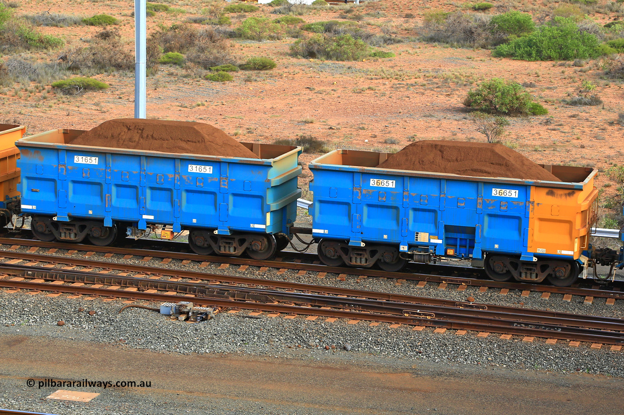 240619 0410
Cape Lambert yard, one of Rio Tinto's blue rakes with spring park brake and only electronic controlled pneumatic [ECP] braking, waggon pair 31651 is a master and is bar coupled to slave waggon 36651 built by China Northen as a Q type in 11/2022. Captured on June 19, 2024.
Keywords: 31651;36651;Q-type;China-Northern;Rio-ore-waggon;