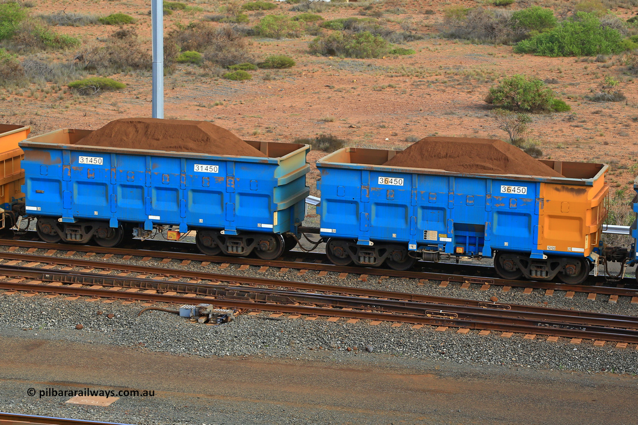 240619 0416
Cape Lambert yard, one of Rio Tinto's blue rakes with spring park brake and only electronic controlled pneumatic [ECP] braking, waggon pair 31450 is a master and is bar coupled to slave waggon 36450 built by China Northen as a Q type in 12/2022. Captured on June 19, 2024.
Keywords: 31450;36450;Q-type;China-Northern;Rio-ore-waggon;
