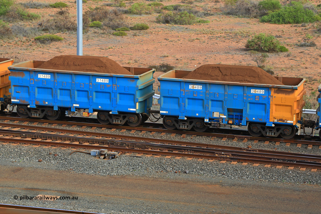 240619 0419
Cape Lambert yard, one of Rio Tinto's blue rakes with spring park brake and only electronic controlled pneumatic [ECP] braking, waggon pair 31489 is a master and is bar coupled to slave waggon 36489 built by China Northen as a Q type in 12/2022. Captured on June 19, 2024.
Keywords: 31489;36489;Q-type;China-Northern;Rio-ore-waggon;