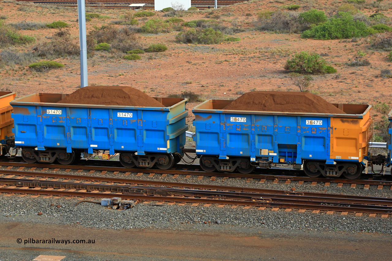 240619 0425
Cape Lambert yard, one of Rio Tinto's blue rakes with spring park brake and only electronic controlled pneumatic [ECP] braking, waggon pair 31470 is a master and is bar coupled to slave waggon 36470 built by China Northen as a Q type in 12/2022. Captured on June 19, 2024.
Keywords: 31470;36470;Q-type;China-Northern;Rio-ore-waggon;