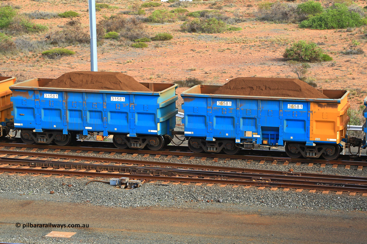 240619 0433
Cape Lambert yard, one of Rio Tinto's blue rakes with spring park brake and only electronic controlled pneumatic [ECP] braking, waggon pair 31581 is a master and is bar coupled to slave waggon 36581 built by China Northen as a Q type in 12/2022. Captured on June 19, 2024.
Keywords: 31581;36581;Q-type;China-Northern;Rio-ore-waggon;