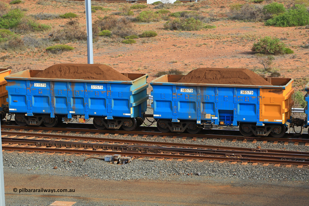 240619 0439
Cape Lambert yard, one of Rio Tinto's blue rakes with spring park brake and only electronic controlled pneumatic [ECP] braking, waggon pair 31579 is a master and is bar coupled to slave waggon 36579 built by China Northen as a Q type in 12/2022. Captured on June 19, 2024.
Keywords: 31579;36579;Q-type;China-Northern;Rio-ore-waggon;