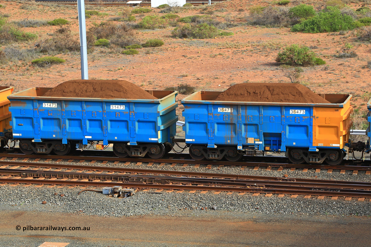 240619 0440
Cape Lambert yard, one of Rio Tinto's blue rakes with spring park brake and only electronic controlled pneumatic [ECP] braking, waggon pair 31473 is a master and is bar coupled to slave waggon 36473 built by China Northen as a Q type in 12/2022. Captured on June 19, 2024.
Keywords: 31473;36473;Q-type;China-Northern;Rio-ore-waggon;