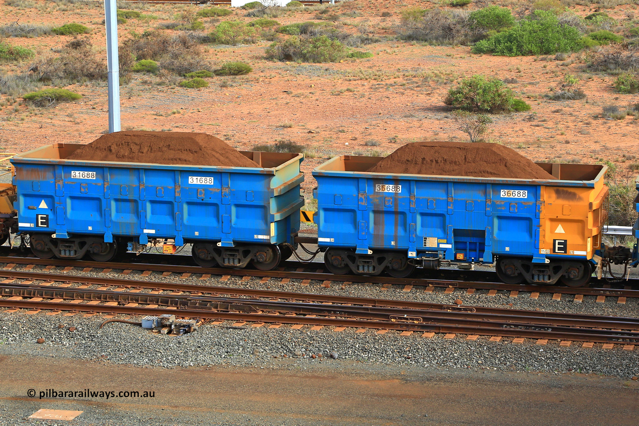 240619 0456
Cape Lambert yard, one of Rio Tinto's blue rakes with spring park brake and only electronic controlled pneumatic [ECP] braking, waggon pair 31688 is a master and is bar coupled to slave waggon 36688 built by China Northen as a Q type in 11/2022. Captured on June 19, 2024.
Keywords: 31688;36688;Q-type;China-Northern;Rio-ore-waggon;