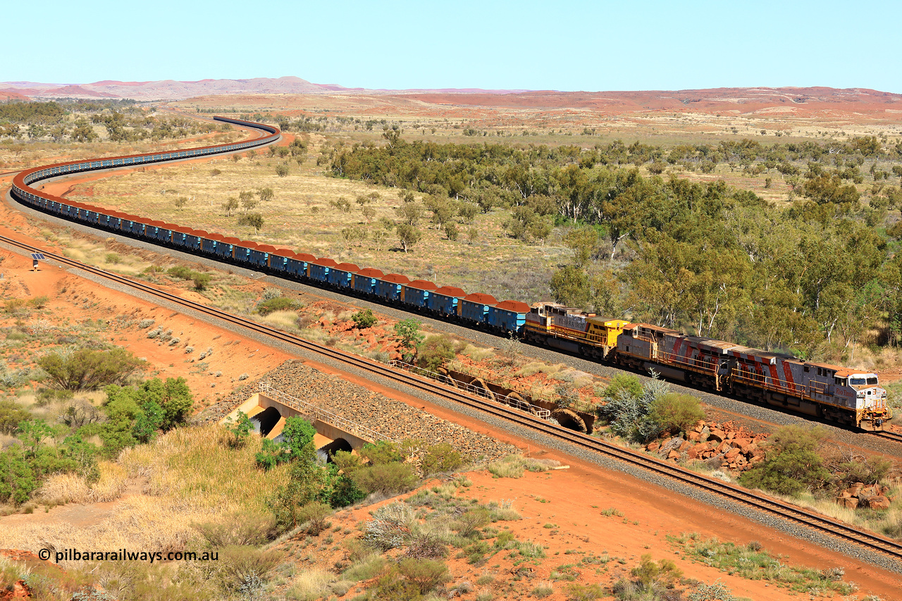 240701 2381
Western Creek, 67 km, Rio Tinto's GE built ES44DCi locomotive 9141 with serial number 64731, delivered in 2018 from the sixth order of this model from GE leads an ES44DCi and 9-44CW locomotives as they snake around the curve between Western Creek and Green Pool with a loaded train of the second rake of blue waggons bound for Cape Lambert. Captured on July 1, 2024.
Keywords: 9141;GE;ES44ACi;64731;