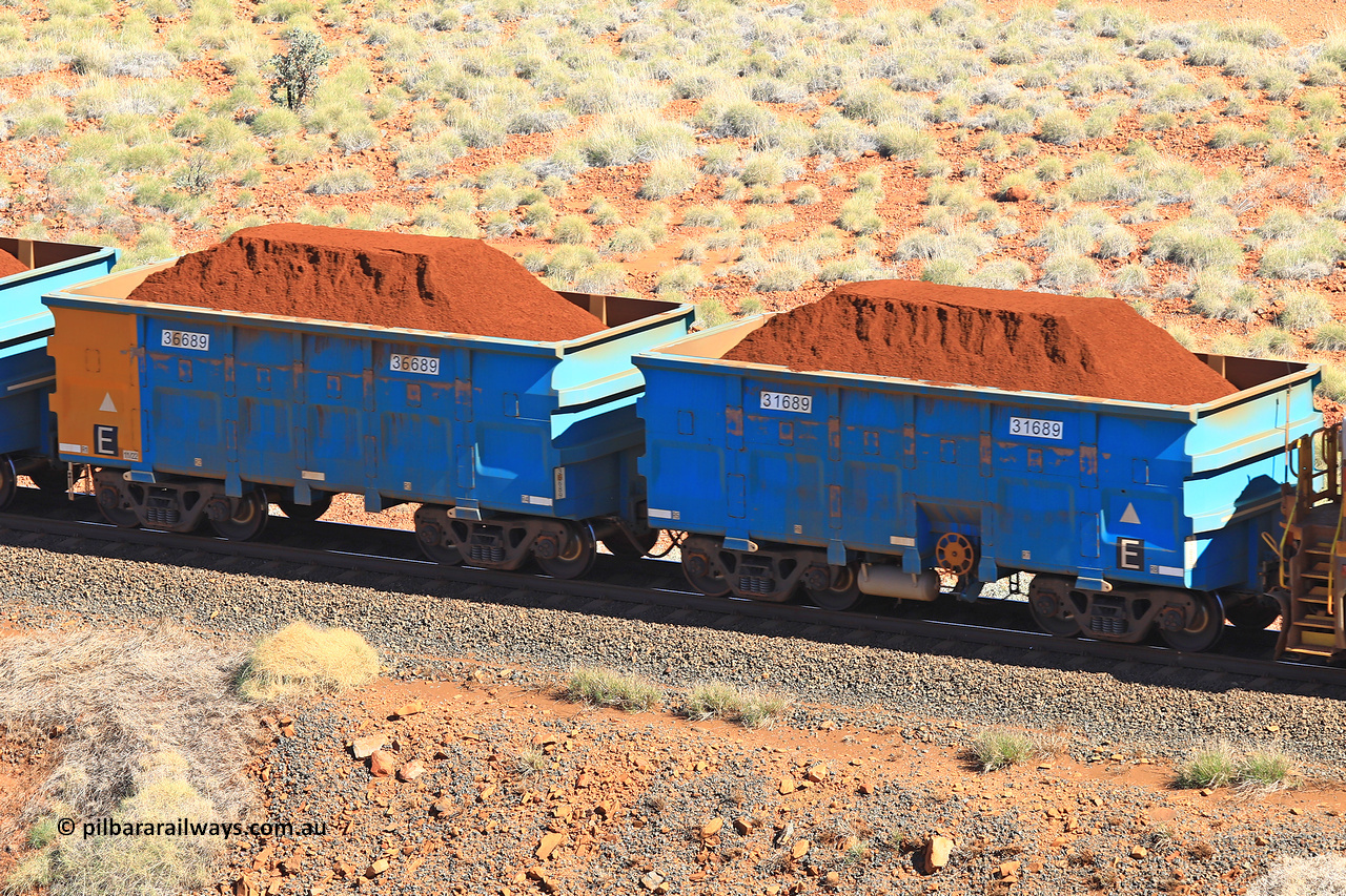 240701 2385
Western Creek, 67 km, one of Rio Tinto's blue rakes with spring assisted park brake and only electronic controlled pneumatic [ECP] braking, waggon pair 31689 is a master and is bar coupled to slave waggon 36689 built by China Northen as a Q type in 11/2022. Captured on July 1, 2024.
Keywords: 31689;36689;Q-type;China-Northern;Rio-ore-waggon;