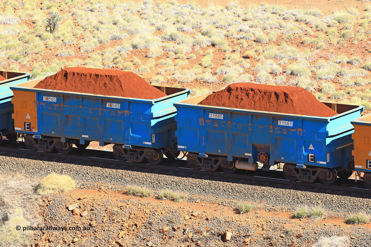 240701 2386
Western Creek, 67 km, one of Rio Tinto's blue rakes with spring assisted park brake and only electronic controlled pneumatic [ECP] braking, waggon pair 31565 is a master and is bar coupled to slave waggon 36565 built by China Northen as a Q type in 11/2022. Captured on July 1, 2024.
Keywords: 31565;36565;Q-type;China-Northern;Rio-ore-waggon;