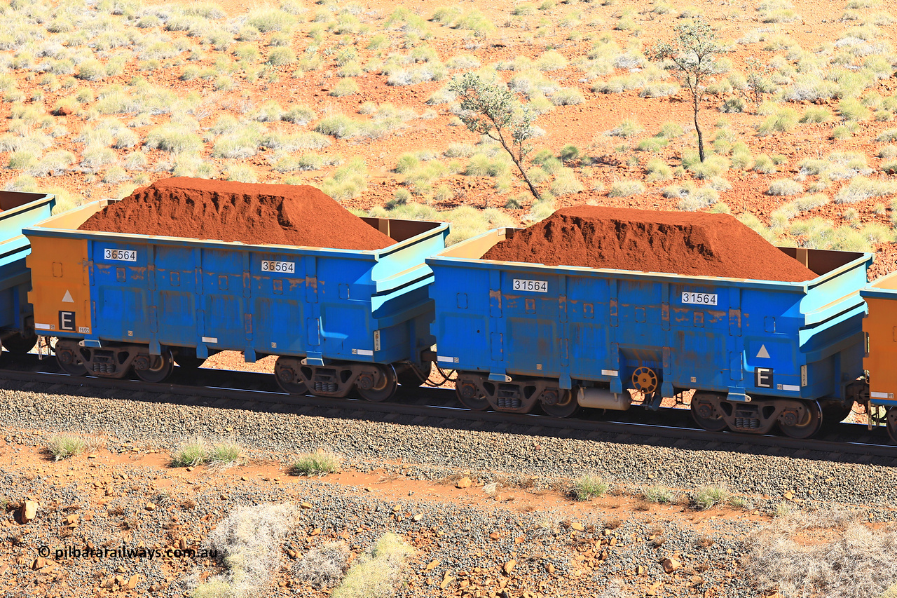 240701 2387
Western Creek, 67 km, one of Rio Tinto's blue rakes with spring assisted park brake and only electronic controlled pneumatic [ECP] braking, waggon pair 31564 is a master and is bar coupled to slave waggon 36564 built by China Northen as a Q type in 11/2022. Captured on July 1, 2024.
Keywords: 31564;36564;Q-type;China-Northern;Rio-ore-waggon;