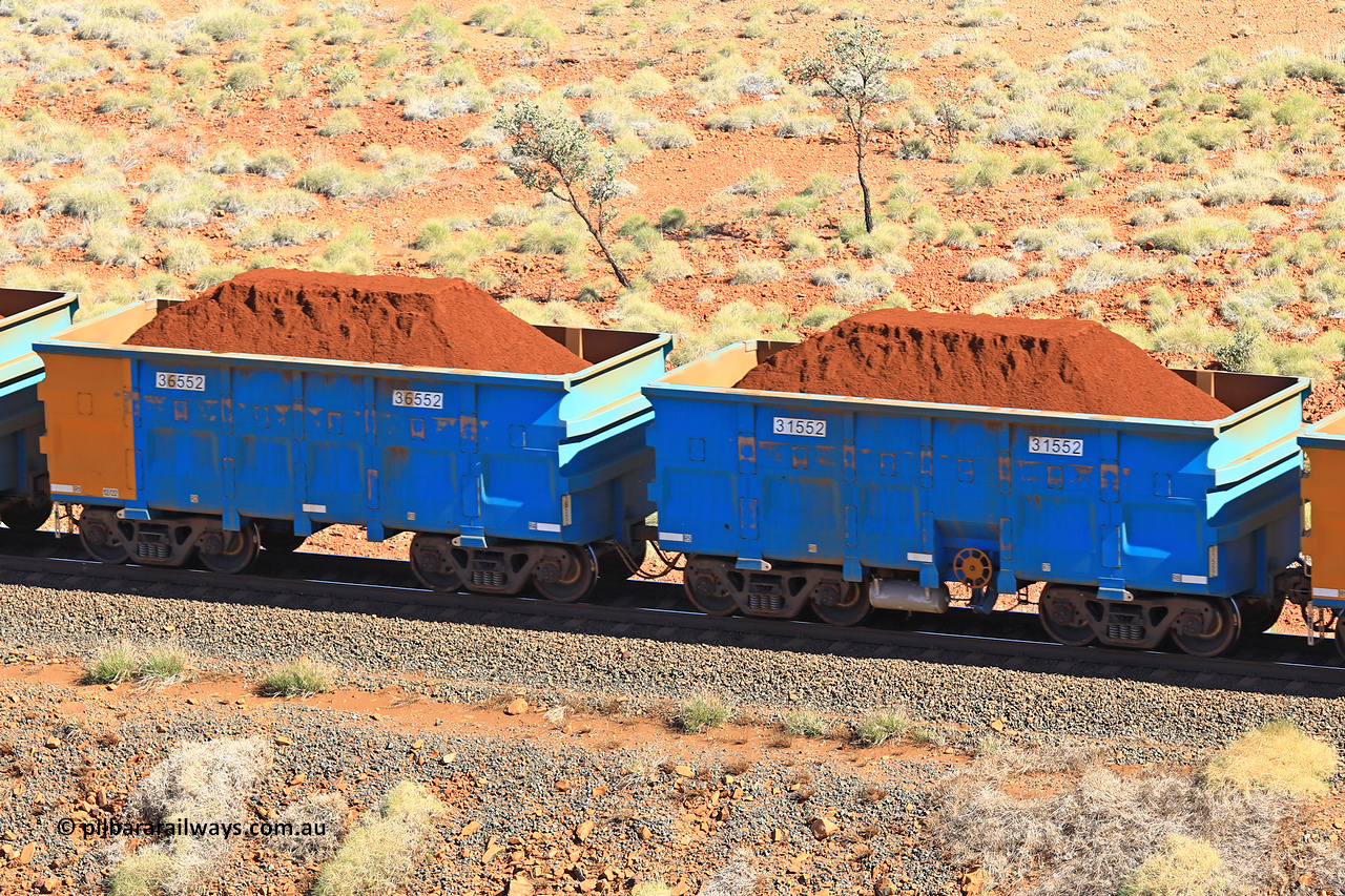 240701 2388
Western Creek, 67 km, one of Rio Tinto's blue rakes with spring assisted park brake and only electronic controlled pneumatic [ECP] braking, waggon pair 31552 is a master and is bar coupled to slave waggon 36552 built by China Northen as a Q type in 12/2022. Captured on July 1, 2024.
Keywords: 31552;36552;Q-type;China-Northern;Rio-ore-waggon;