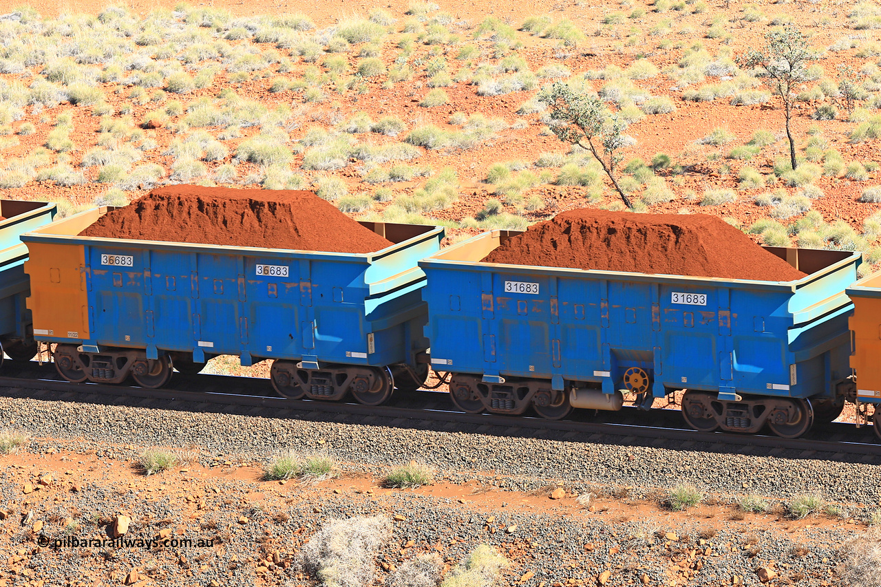 240701 2390
Western Creek, 67 km, one of Rio Tinto's blue rakes with spring assisted park brake and only electronic controlled pneumatic [ECP] braking, waggon pair 31683 is a master and is bar coupled to slave waggon 36683 built by China Northen as a Q type in 11/2022. Captured on July 1, 2024.
Keywords: 31683;36683;Q-type;China-Northern;Rio-ore-waggon;