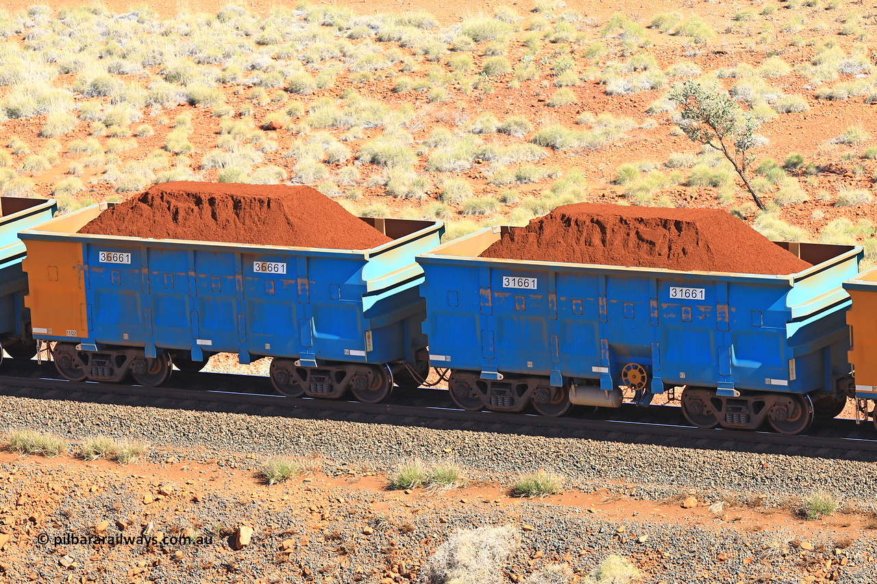 240701 2394
Western Creek, 67 km, one of Rio Tinto's blue rakes with spring assisted park brake and only electronic controlled pneumatic [ECP] braking, waggon pair 31661 is a master and is bar coupled to slave waggon 36661 built by China Northen as a Q type in 11/2022. Captured on July 1, 2024.
Keywords: 31661;36661;Q-type;China-Northern;Rio-ore-waggon;