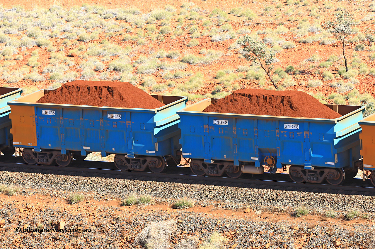 240701 2395
Western Creek, 67 km, one of Rio Tinto's blue rakes with spring assisted park brake and only electronic controlled pneumatic [ECP] braking, waggon pair 31678 is a master and is bar coupled to slave waggon 36678 built by China Northen as a Q type in 11/2022. Captured on July 1, 2024.
Keywords: 31678;36678;Q-type;China-Northern;Rio-ore-waggon;