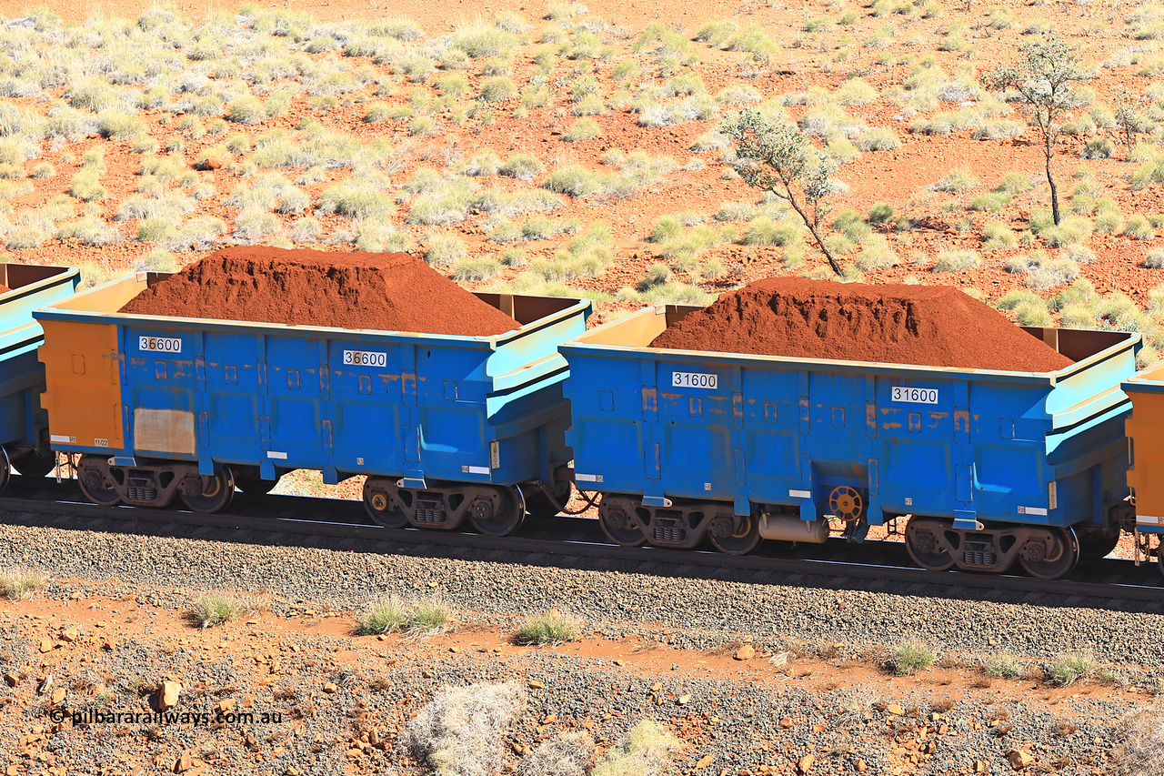 240701 2396
Western Creek, 67 km, one of Rio Tinto's blue rakes with spring assisted park brake and only electronic controlled pneumatic [ECP] braking, waggon pair 31600 is a master and is bar coupled to slave waggon 36600 built by China Northen as a Q type in 11/2022. Captured on July 1, 2024.
Keywords: 31600;36600;Q-type;China-Northern;Rio-ore-waggon;