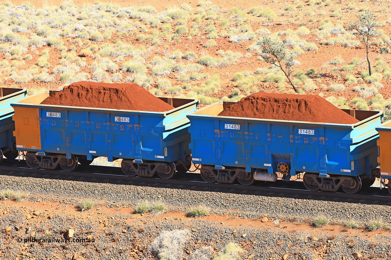240701 2398
Western Creek, 67 km, one of Rio Tinto's blue rakes with spring assisted park brake and only electronic controlled pneumatic [ECP] braking, waggon pair 31483 is a master and is bar coupled to slave waggon 36483 built by China Northen as a Q type in 12/2022. Captured on July 1, 2024.
Keywords: 31483;36483;Q-type;China-Northern;Rio-ore-waggon;