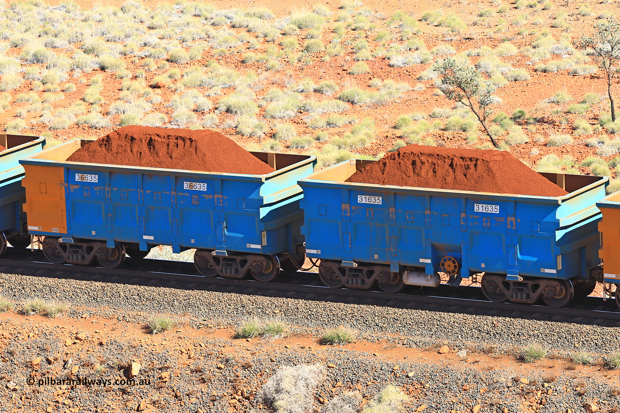 240701 2399
Western Creek, 67 km, one of Rio Tinto's blue rakes with spring assisted park brake and only electronic controlled pneumatic [ECP] braking, waggon pair 31635 is a master and is bar coupled to slave waggon 36635 built by China Northen as a Q type in 11/2022. Captured on July 1, 2024.
Keywords: 31635;36635;Q-type;China-Northern;Rio-ore-waggon;
