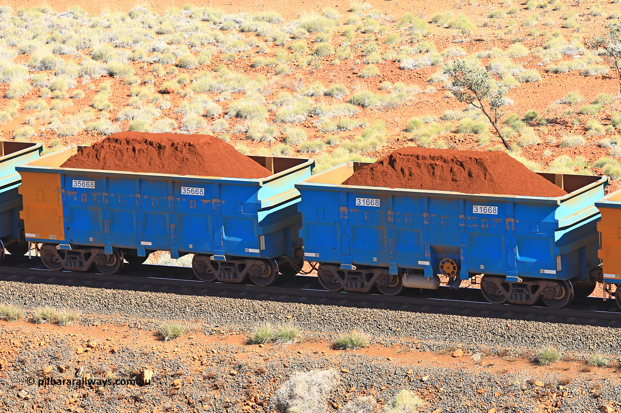 240701 2400
Western Creek, 67 km, one of Rio Tinto's blue rakes with spring assisted park brake and only electronic controlled pneumatic [ECP] braking, waggon pair 31668 is a master and is bar coupled to slave waggon 35668 built by China Northen as a Q type in 11/2022. Captured on July 1, 2024.
Keywords: 31668;35668;Q-type;China-Northern;Rio-ore-waggon;