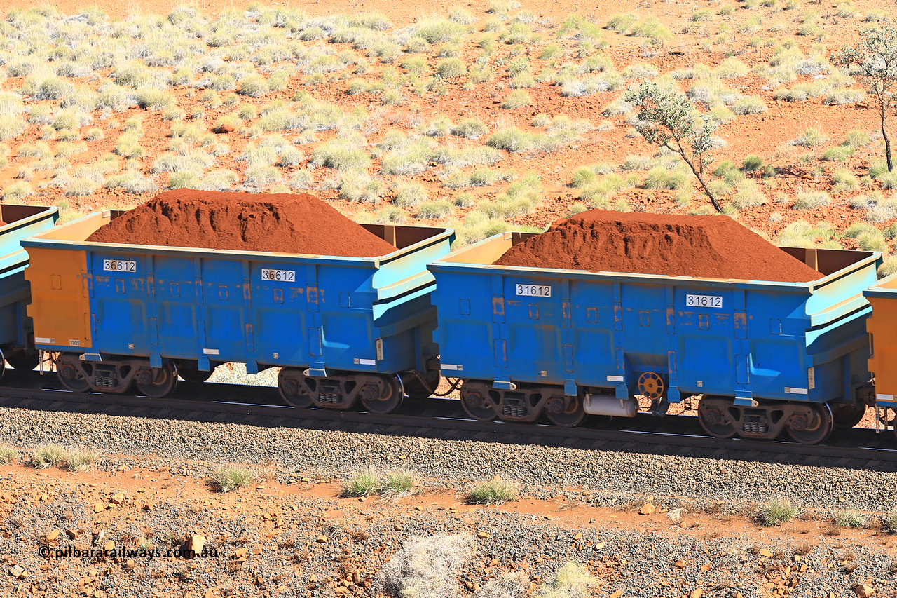 240701 2402
Western Creek, 67 km, one of Rio Tinto's blue rakes with spring assisted park brake and only electronic controlled pneumatic [ECP] braking, waggon pair 31612 is a master and is bar coupled to slave waggon 36612 built by China Northen as a Q type in 11/2022. Captured on July 1, 2024.
Keywords: 31612;36612;Q-type;China-Northern;Rio-ore-waggon;