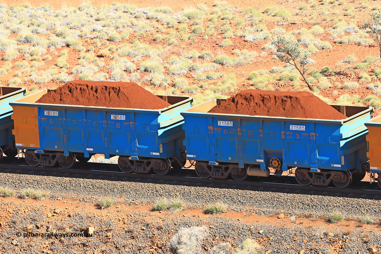 240701 2404
Western Creek, 67 km, one of Rio Tinto's blue rakes with spring assisted park brake and only electronic controlled pneumatic [ECP] braking, waggon pair 31585 is a master and is bar coupled to slave waggon 36585 built by China Northen as a Q type in 11/2022. Captured on July 1, 2024.
Keywords: 31585;36585;Q-type;China-Northern;Rio-ore-waggon;
