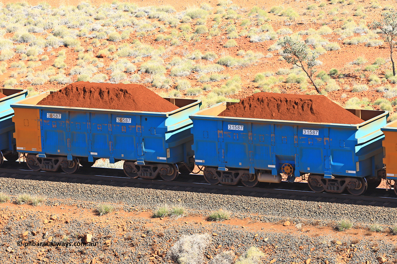 240701 2405
Western Creek, 67 km, one of Rio Tinto's blue rakes with spring assisted park brake and only electronic controlled pneumatic [ECP] braking, waggon pair 31587 is a master and is bar coupled to slave waggon 36587 built by China Northen as a Q type in 11/2022. Captured on July 1, 2024.
Keywords: 31587;36587;Q-type;China-Northern;Rio-ore-waggon;