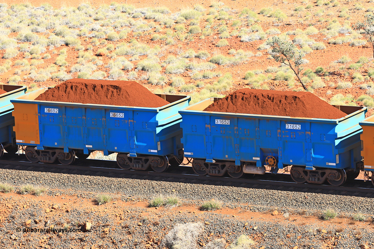 240701 2406
Western Creek, 67 km, one of Rio Tinto's blue rakes with spring assisted park brake and only electronic controlled pneumatic [ECP] braking, waggon pair 31652 is a master and is bar coupled to slave waggon 36652 built by China Northen as a Q type in 12/2022. Captured on July 1, 2024.
Keywords: 31652;36652;Q-type;China-Northern;Rio-ore-waggon;