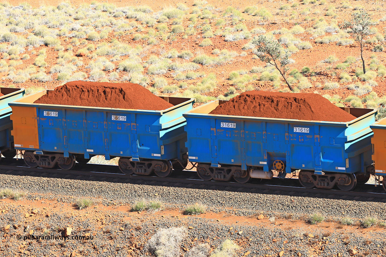 240701 2410
Western Creek, 67 km, one of Rio Tinto's blue rakes with spring assisted park brake and only electronic controlled pneumatic [ECP] braking, waggon pair 31619 is a master and is bar coupled to slave waggon 36619 built by China Northen as a Q type in 11/2022. Captured on July 1, 2024.
Keywords: 31619;36619;Q-type;China-Northern;Rio-ore-waggon;
