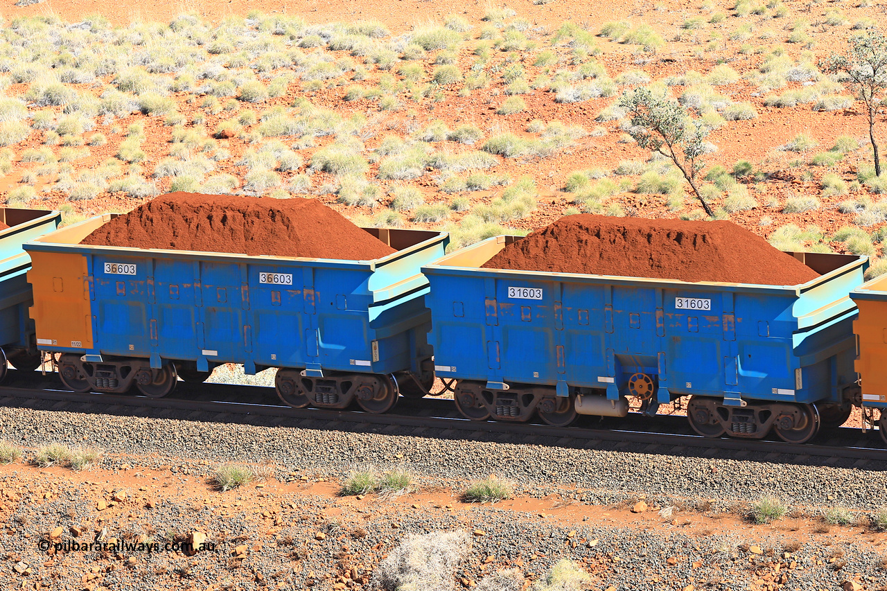 240701 2411
Western Creek, 67 km, one of Rio Tinto's blue rakes with spring assisted park brake and only electronic controlled pneumatic [ECP] braking, waggon pair 31603 is a master and is bar coupled to slave waggon 36603 built by China Northen as a Q type in 11/2022. Captured on July 1, 2024.
Keywords: 31603;36603;Q-type;China-Northern;Rio-ore-waggon;