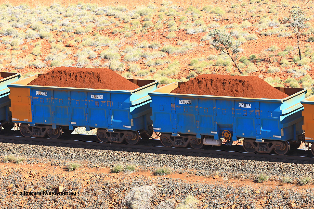 240701 2414
Western Creek, 67 km, one of Rio Tinto's blue rakes with spring assisted park brake and only electronic controlled pneumatic [ECP] braking, waggon pair 31626 is a master and is bar coupled to slave waggon 36626 built by China Northen as a Q type in 11/2022. Captured on July 1, 2024.
Keywords: 31626;36626;Q-type;China-Northern;Rio-ore-waggon;