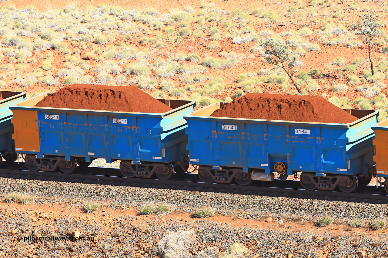 240701 2415
Western Creek, 67 km, one of Rio Tinto's blue rakes with spring assisted park brake and only electronic controlled pneumatic [ECP] braking, waggon pair 31641 is a master and is bar coupled to slave waggon 36641 built by China Northen as a Q type in 11/2022. Captured on July 1, 2024.
Keywords: 31641;36641;Q-type;China-Northern;Rio-ore-waggon;