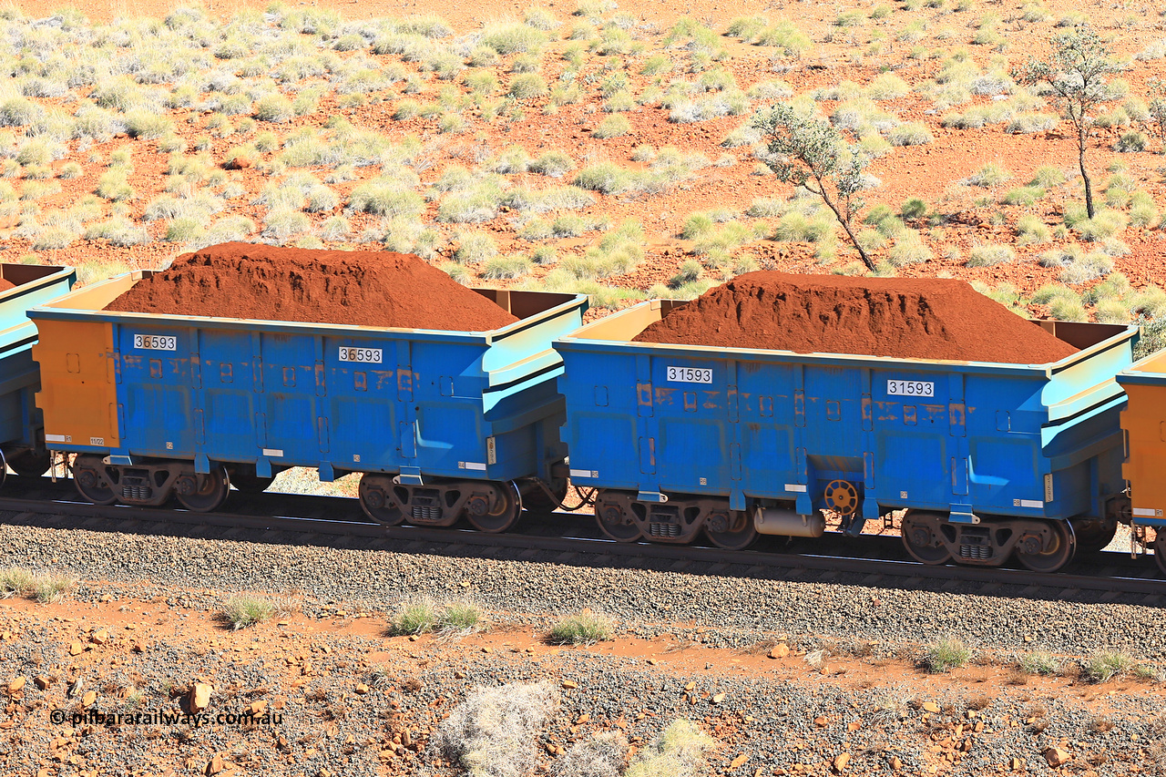 240701 2417
Western Creek, 67 km, one of Rio Tinto's blue rakes with spring assisted park brake and only electronic controlled pneumatic [ECP] braking, waggon pair 31593 is a master and is bar coupled to slave waggon 36593 built by China Northen as a Q type in 11/2022. Captured on July 1, 2024.
Keywords: 31593;36593;Q-type;China-Northern;Rio-ore-waggon;