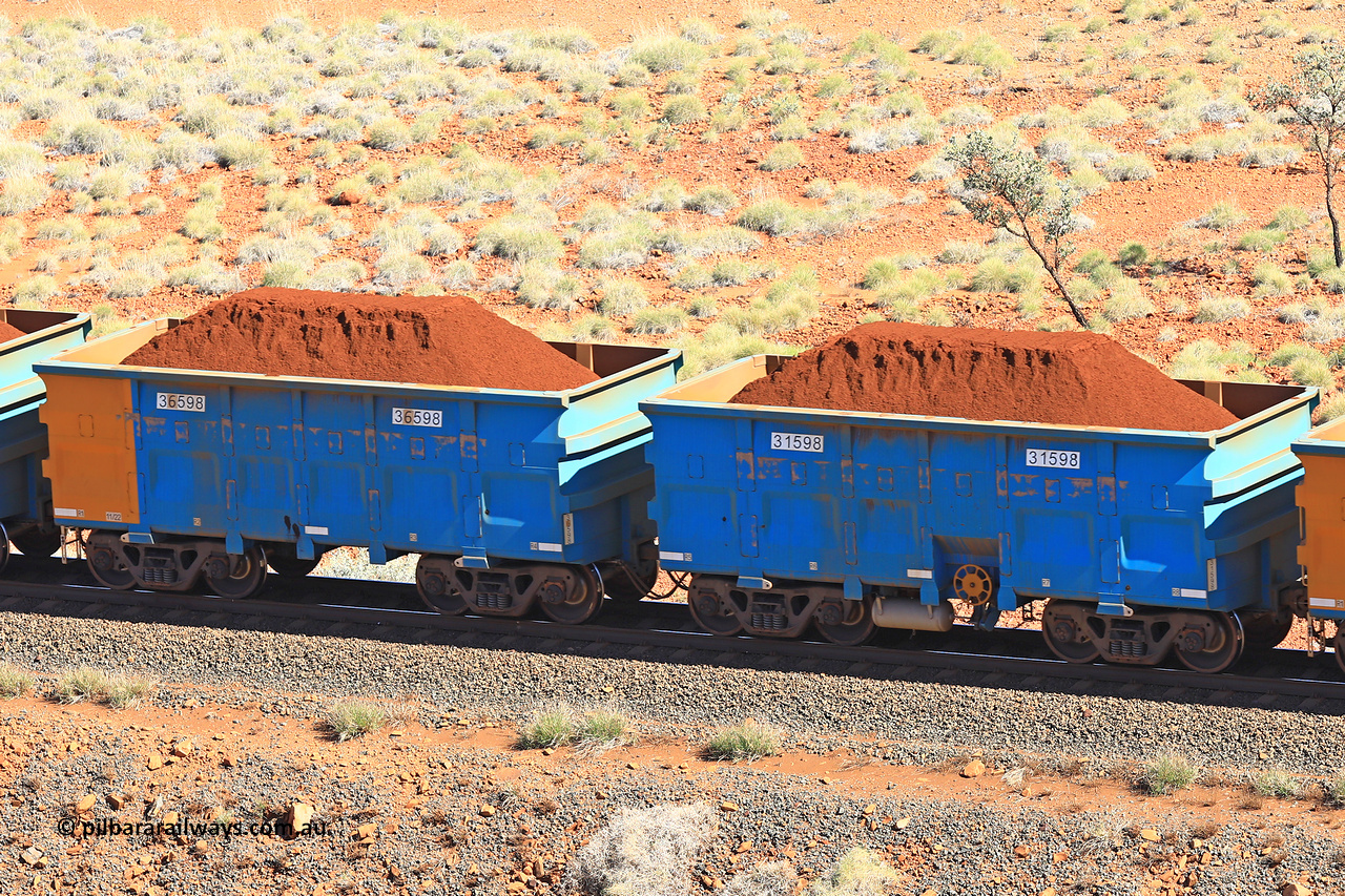 240701 2419
Western Creek, 67 km, one of Rio Tinto's blue rakes with spring assisted park brake and only electronic controlled pneumatic [ECP] braking, waggon pair 31598 is a master and is bar coupled to slave waggon 36598 built by China Northen as a Q type in 11/2022. Captured on July 1, 2024.
Keywords: 31598;36598;Q-type;China-Northern;Rio-ore-waggon;