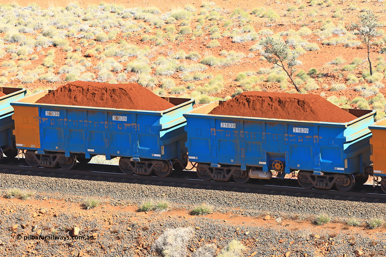 240701 2420
Western Creek, 67 km, one of Rio Tinto's blue rakes with spring assisted park brake and only electronic controlled pneumatic [ECP] braking, waggon pair 31639 is a master and is bar coupled to slave waggon 36639 built by China Northen as a Q type in 11/2022. Captured on July 1, 2024.
Keywords: 31639;36639;Q-type;China-Northern;Rio-ore-waggon;