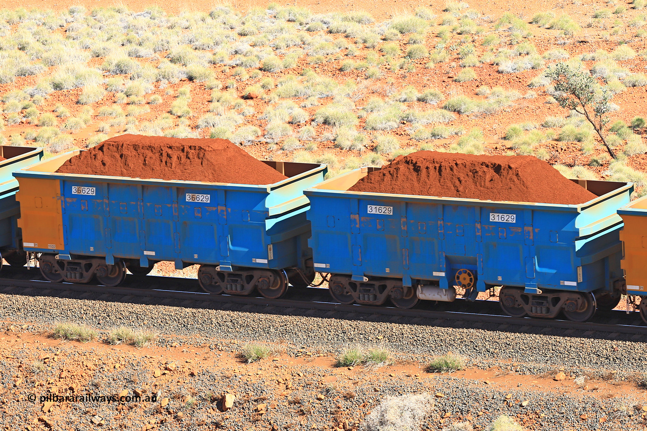 240701 2421
Western Creek, 67 km, one of Rio Tinto's blue rakes with spring assisted park brake and only electronic controlled pneumatic [ECP] braking, waggon pair 31629 is a master and is bar coupled to slave waggon 36629 built by China Northen as a Q type in 11/2022. Captured on July 1, 2024.
Keywords: 31629;36629;Q-type;China-Northern;Rio-ore-waggon;