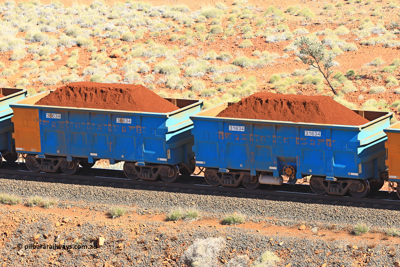 240701 2424
Western Creek, 67 km, one of Rio Tinto's blue rakes with spring assisted park brake and only electronic controlled pneumatic [ECP] braking, waggon pair 31634 is a master and is bar coupled to slave waggon 36634 built by China Northen as a Q type in 11/2022. Captured on July 1, 2024.
Keywords: 31634;36634;Q-type;China-Northern;Rio-ore-waggon;