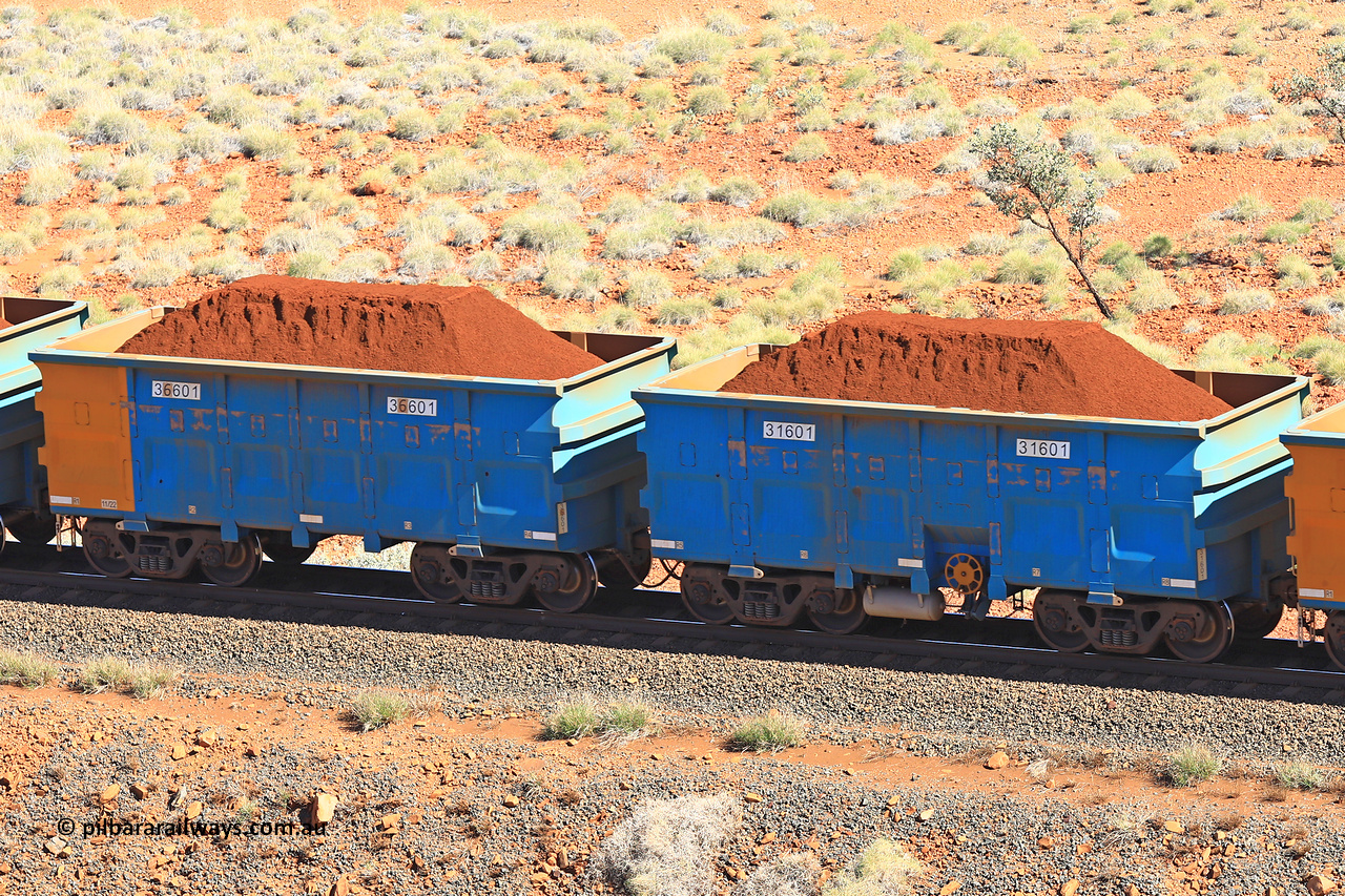 240701 2425
Western Creek, 67 km, one of Rio Tinto's blue rakes with spring assisted park brake and only electronic controlled pneumatic [ECP] braking, waggon pair 31601 is a master and is bar coupled to slave waggon 36601 built by China Northen as a Q type in 11/2022. Captured on July 1, 2024.
Keywords: 31601;36601;Q-type;China-Northern;Rio-ore-waggon;