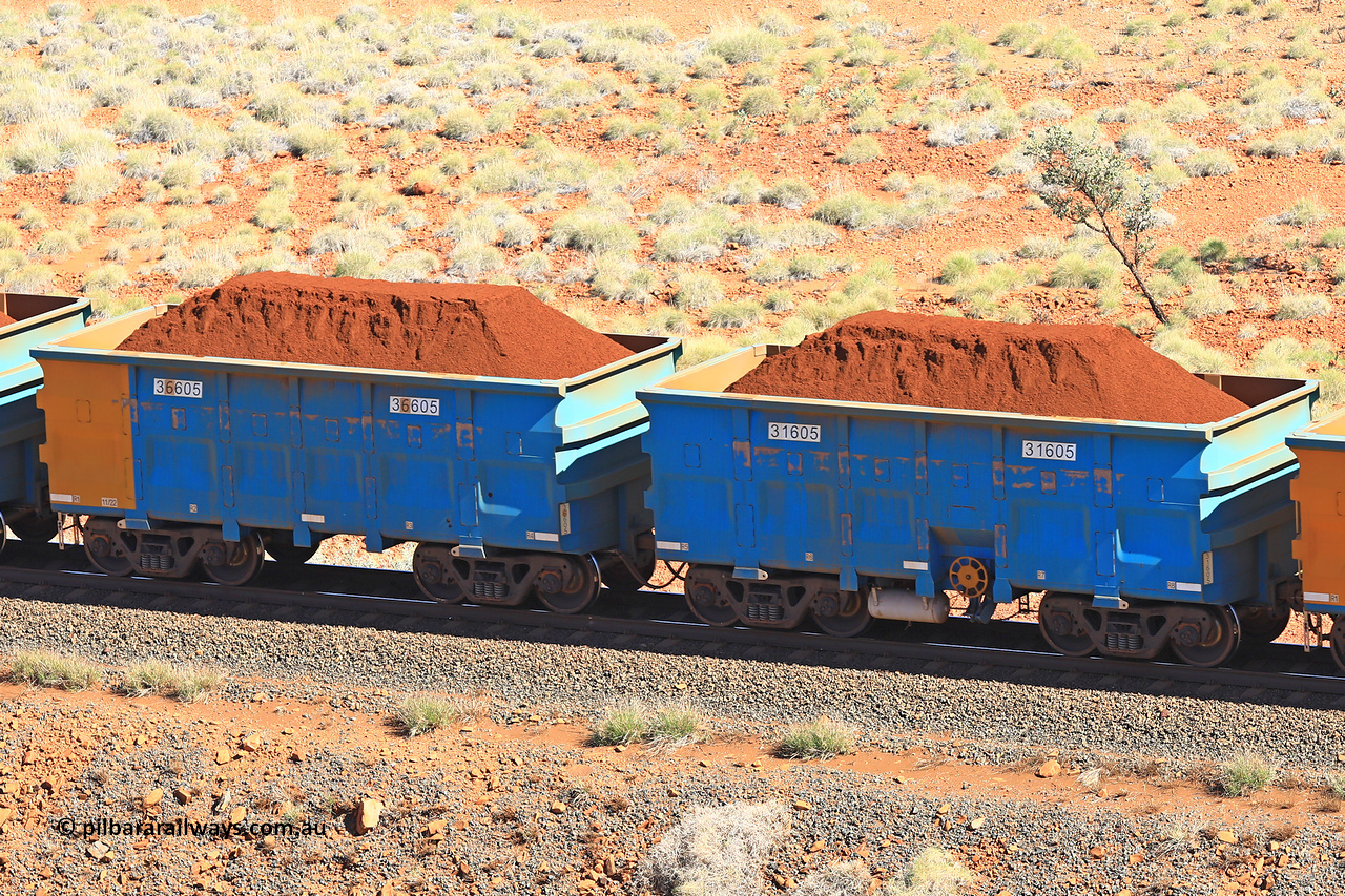 240701 2427
Western Creek, 67 km, one of Rio Tinto's blue rakes with spring assisted park brake and only electronic controlled pneumatic [ECP] braking, waggon pair 31605 is a master and is bar coupled to slave waggon 36605 built by China Northen as a Q type in 11/2022. Captured on July 1, 2024.
Keywords: 31605;36605;Q-type;China-Northern;Rio-ore-waggon;