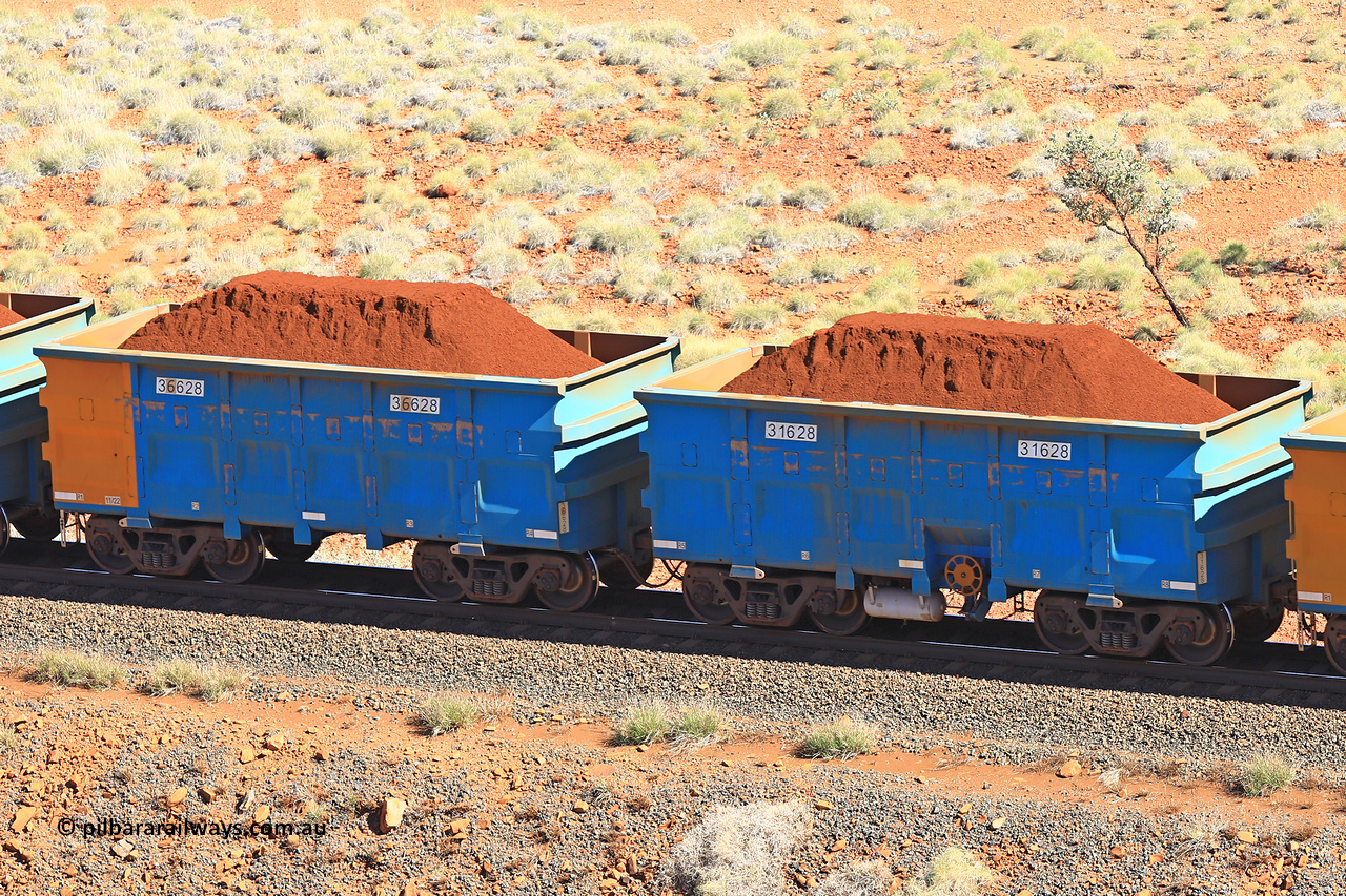 240701 2428
Western Creek, 67 km, one of Rio Tinto's blue rakes with spring assisted park brake and only electronic controlled pneumatic [ECP] braking, waggon pair 31628 is a master and is bar coupled to slave waggon 36628 built by China Northen as a Q type in 11/2022. Captured on July 1, 2024.
Keywords: 31628;36628;Q-type;China-Northern;Rio-ore-waggon;