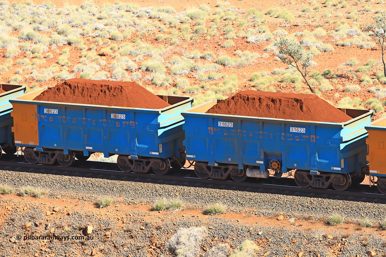 240701 2433
Western Creek, 67 km, one of Rio Tinto's blue rakes with spring assisted park brake and only electronic controlled pneumatic [ECP] braking, waggon pair 31623 is a master and is bar coupled to slave waggon 36623 built by China Northen as a Q type in 11/2022. Captured on July 1, 2024.
Keywords: 31623;36623;Q-type;China-Northern;Rio-ore-waggon;