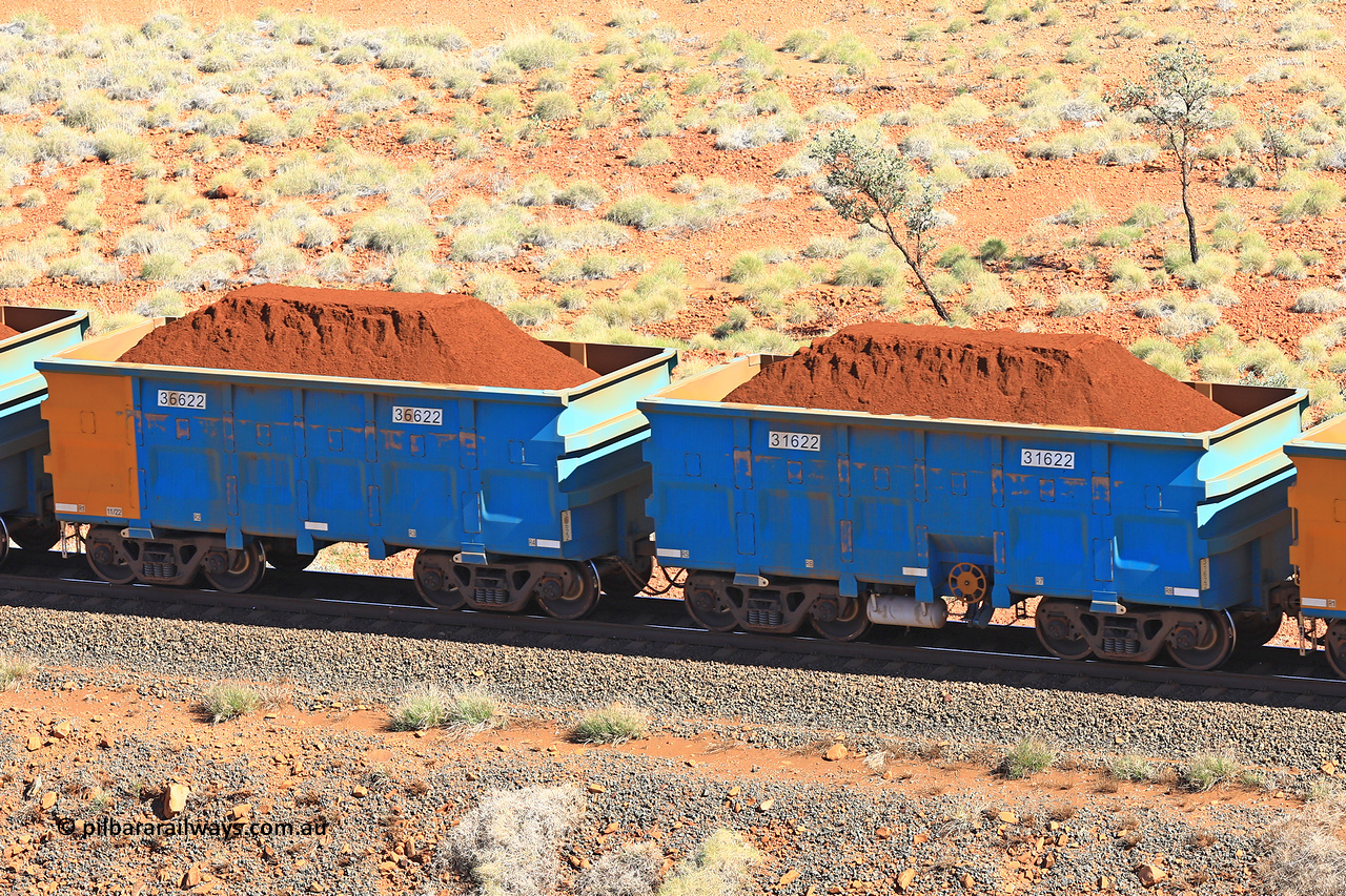 240701 2434
Western Creek, 67 km, one of Rio Tinto's blue rakes with spring assisted park brake and only electronic controlled pneumatic [ECP] braking, waggon pair 31622 is a master and is bar coupled to slave waggon 36622 built by China Northen as a Q type in 11/2022. Captured on July 1, 2024.
Keywords: 31622;36622;Q-type;China-Northern;Rio-ore-waggon;