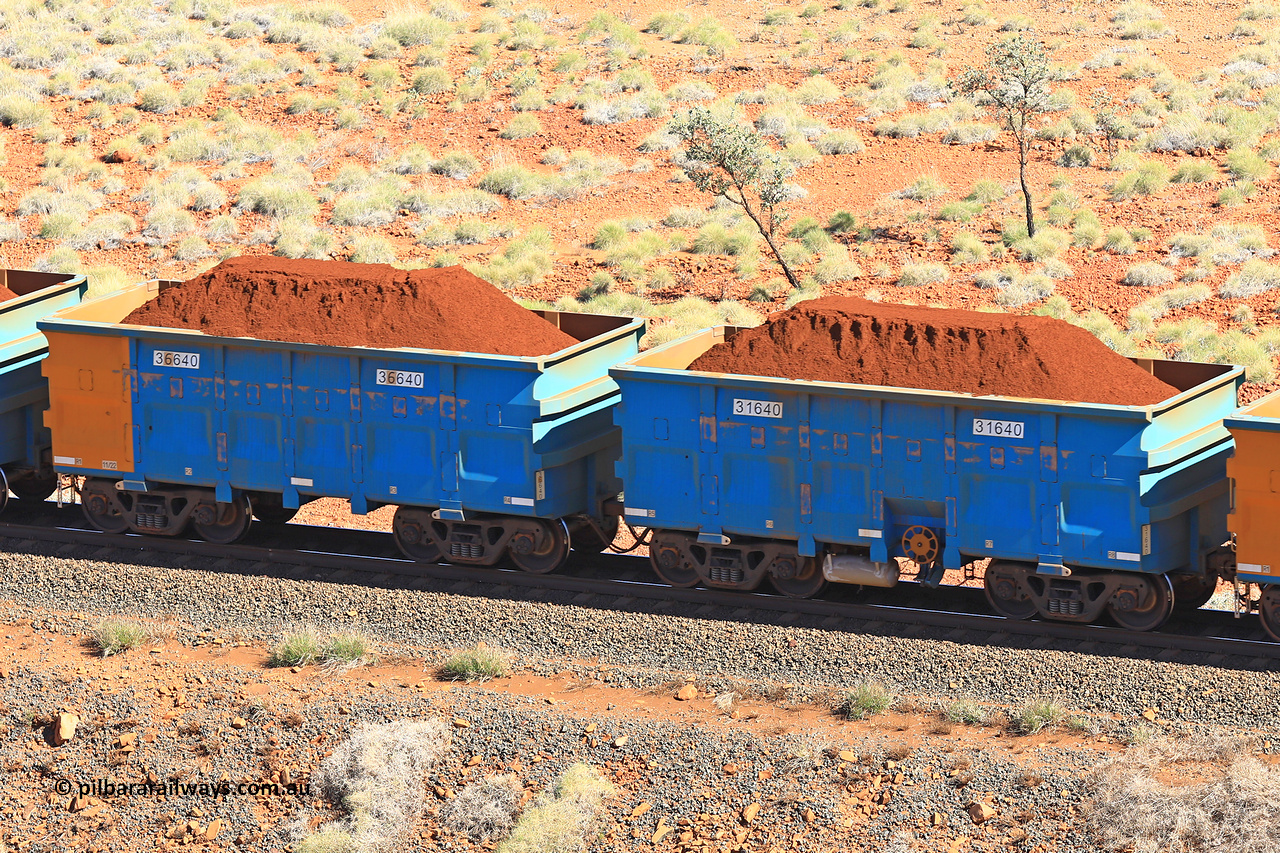 240701 2439
Western Creek, 67 km, one of Rio Tinto's blue rakes with spring assisted park brake and only electronic controlled pneumatic [ECP] braking, waggon pair 31640 is a master and is bar coupled to slave waggon 36640 built by China Northen as a Q type in 11/2022. Captured on July 1, 2024.
Keywords: 31640;36640;Q-type;China-Northern;Rio-ore-waggon;