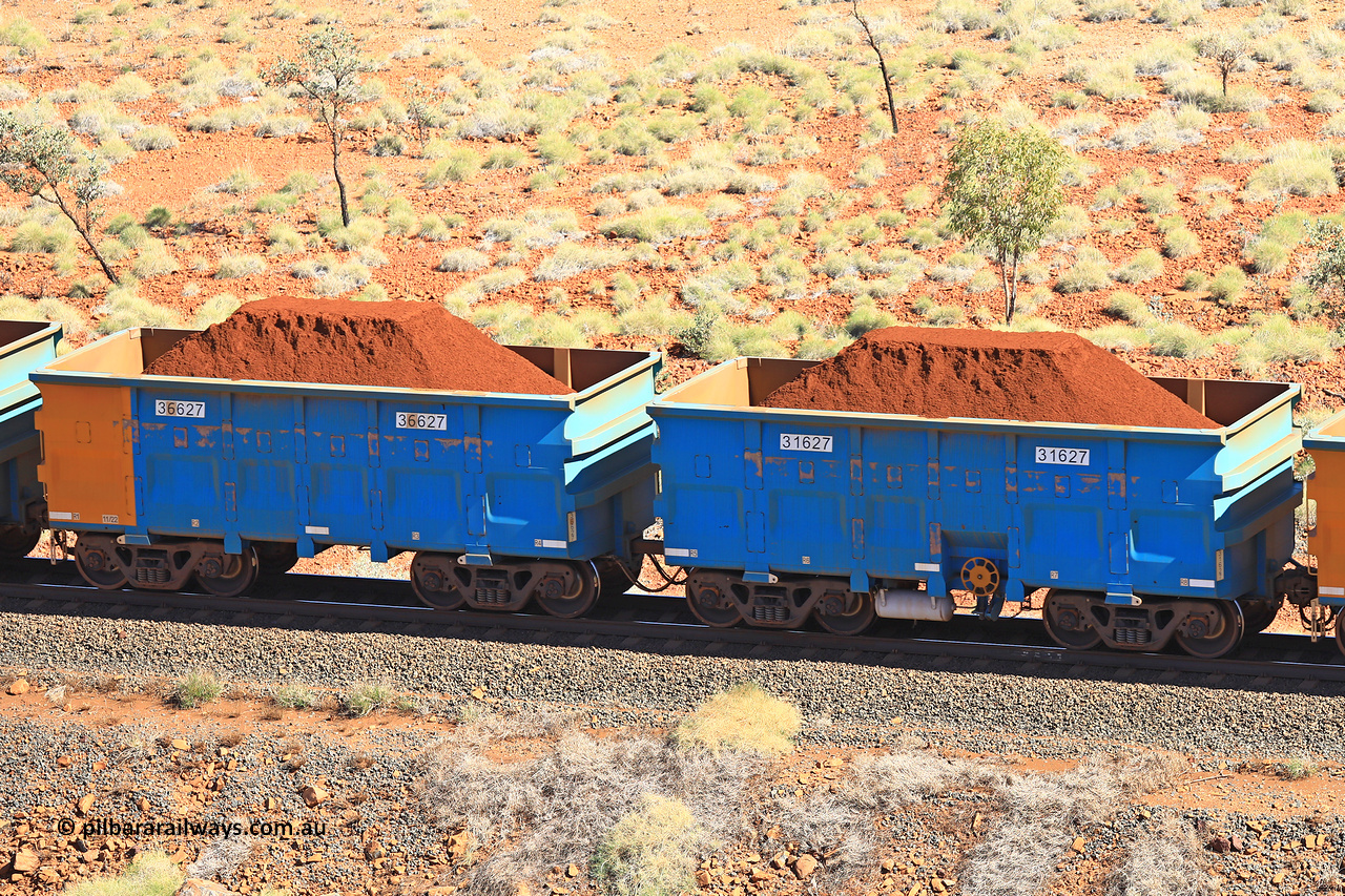 240701 2442
Western Creek, 67 km, one of Rio Tinto's blue rakes with spring assisted park brake and only electronic controlled pneumatic [ECP] braking, waggon pair 31627 is a master and is bar coupled to slave waggon 36627 built by China Northen as a Q type in 11/2022. Captured on July 1, 2024.
Keywords: 31627;36627;Q-type;China-Northern;Rio-ore-waggon;