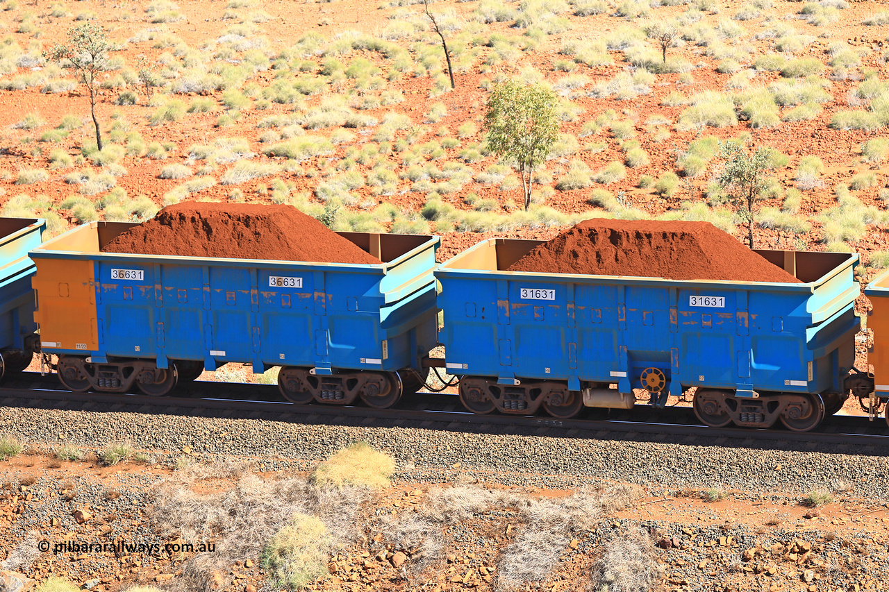 240701 2443
Western Creek, 67 km, one of Rio Tinto's blue rakes with spring assisted park brake and only electronic controlled pneumatic [ECP] braking, waggon pair 31631 is a master and is bar coupled to slave waggon 36631 built by China Northen as a Q type in 11/2022. Captured on July 1, 2024.
Keywords: 31631;36631;Q-type;China-Northern;Rio-ore-waggon;